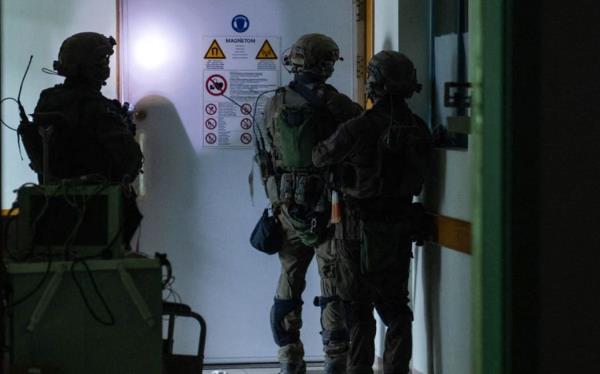This handout picture released by the Israeli army on November 15, 2023, reportedly shows Israeli soldiers carrying out operations inside Al-Shifa hospital in Gaza City, amid co<em></em>ntinuing battles betweeen Israel and the Palestinian militant group Hamas. (Photo by Israeli Army / AFP) / RESTRICTED TO EDITORIAL USE - MANDATORY CREDIT "AFP PHOTO / ISRAELI ARMY " - NO MARKETING NO ADVERTISING CAMPAIGNS - DISTRIBUTED AS A SERVICE TO CLIENTS