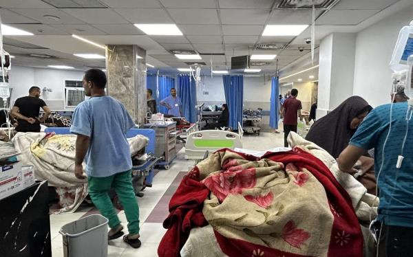 Patients and medics are pictured at Al-Shifa hospital in Gaza City on November 10, 2023, amid o<em></em>ngoing battles between Israel and the Palestinian Hamas movement. Heavy fighting was raging near Al-Shifa hospital, with Israel saying it had killed dozens of militants and destroyed tunnels that are key to Hamas's capacity to fight. Israel launched an offensive in Gaza after Hamas fighters poured across the heavily militarised border on October 7, killing 1,400 people, mostly civilians, and taking around 240 hostages. - NB Reuters report death toll 1200