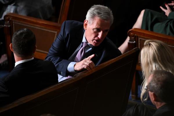 WASHINGTON, DC - October 18 : Rep. Kevin McCarthy (R-Calif.) speaks with others as members of the U.S House of Representatives gather for a second round of voting for the next speaker at the U.S. Capitol on Wednesday October 18, 2023 in Washington, DC. U.S. Rep. Jim Jordan (R-Ohio) failed to reach enough votes during the first round of voting on Tuesday. (Photo by Matt McClain/The Washington Post via Getty Images)