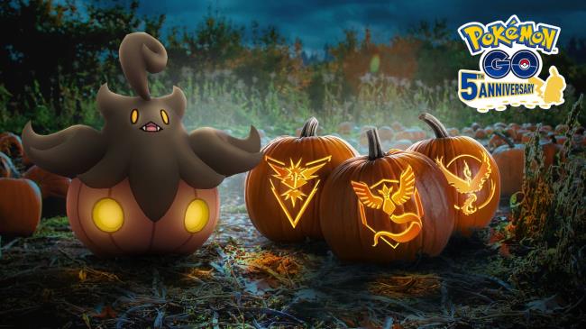 Pumpkaboo next to three pumpkins, each with a Pokemon Go team symbol carved into them