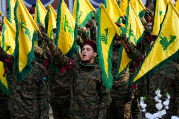 Hezbollah fighters attend the funeral of their commander Wissam al-Tawil, in the village of Khirbet Selm, south Lebanon, Tuesday, Jan. 9, 2024. The elite Hezbollah commander who was killed in an Israeli airstrike Mo<em></em>nday in southern Lebanon fought for the group for decades and took part in some of its biggest battles. (AP Photo/Hussein Malla)