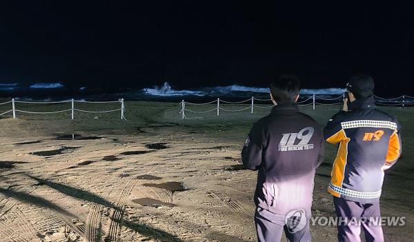 Firefighters patrol Gangneung Port in Gangneung, Gangwon Province, on Jan. 1, 2024, with a 