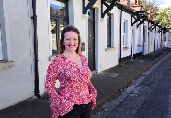  Jen Sheahan outside her house in Rathmines. 'My front door has since crept its way up the list to become one of my favourite features.' Pictures: Moya Nolan