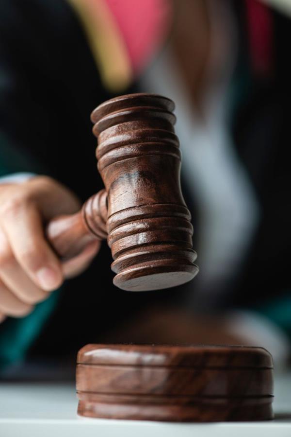 Woman holding gavel.