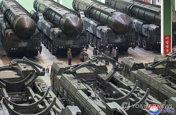 This photo, carried by North Korea's official Korean Central News Agency on Jan. 5, 2024, shows the North's leader Kim Jong-un inspecting a factory that produces major transporter erector launchers. (For Use o<em></em>nly in the Republic of Korea. No Redistribution) (Yonhap)