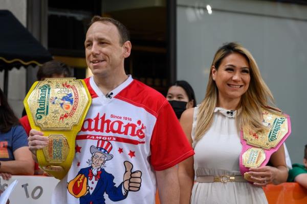 Miki Sudo, pictured with No. 1 men's eater Joey Chestnut, on the 